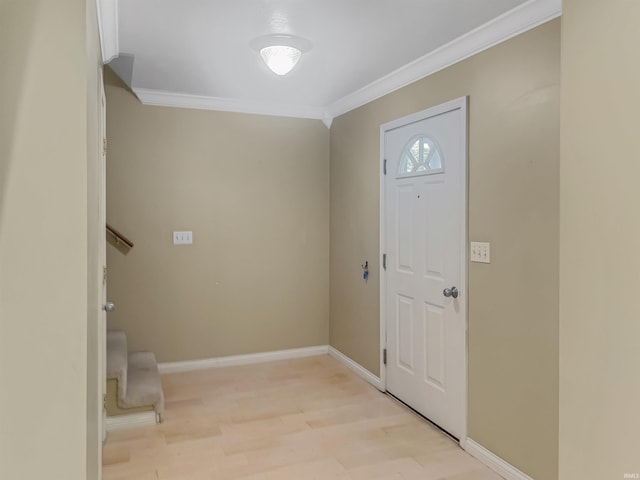 foyer entrance featuring light hardwood / wood-style floors and crown molding