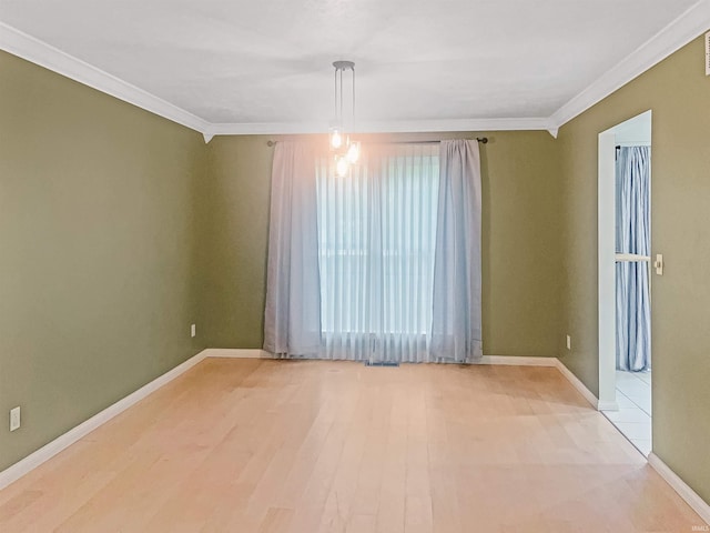 unfurnished room with crown molding and light hardwood / wood-style floors