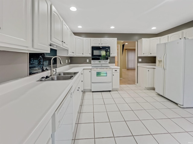 kitchen featuring white cabinets, light tile patterned floors, white appliances, and sink