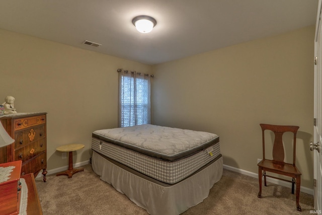 bedroom with light carpet