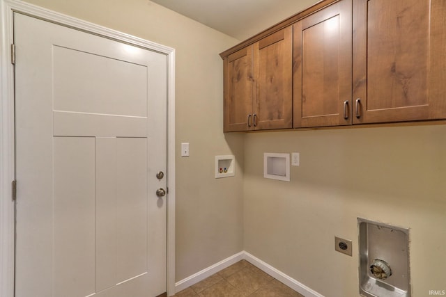 clothes washing area with light tile patterned flooring, washer hookup, electric dryer hookup, and cabinets