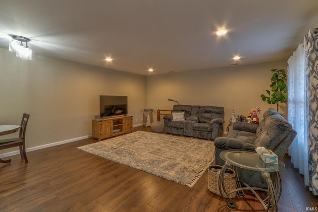 living room with dark hardwood / wood-style floors