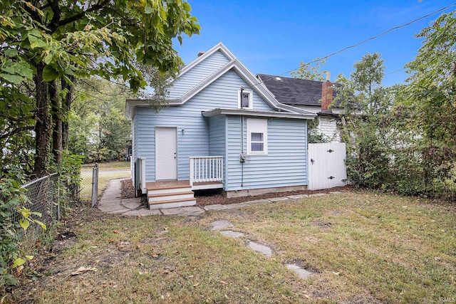 back of house with a yard