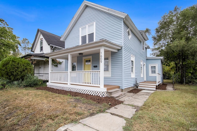 view of front of home featuring a front lawn and covered porch