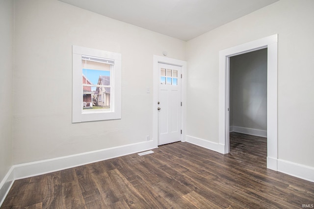 foyer with dark hardwood / wood-style flooring