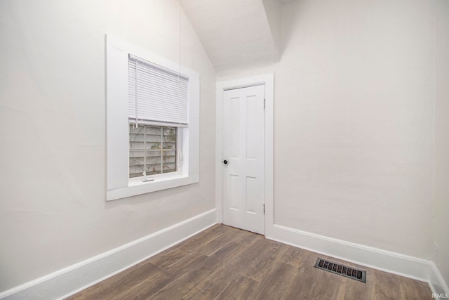 corridor with dark hardwood / wood-style floors