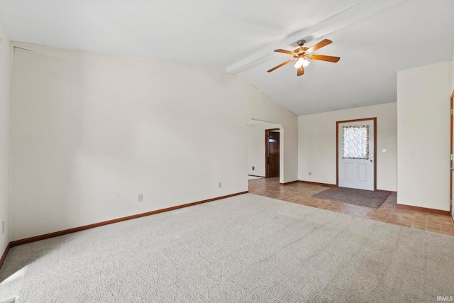 empty room with vaulted ceiling with beams, light carpet, and ceiling fan