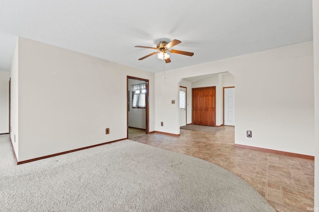 carpeted empty room with ceiling fan