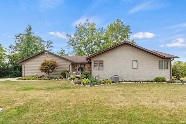 exterior space with cooling unit and a front yard