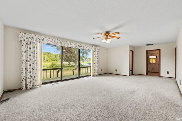 carpeted empty room with ceiling fan