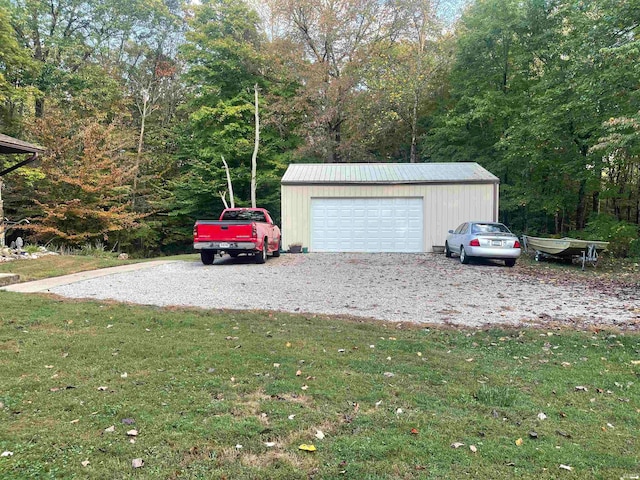 garage featuring a lawn