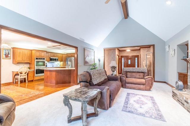 living room with high vaulted ceiling, light wood-type flooring, ceiling fan, and beamed ceiling