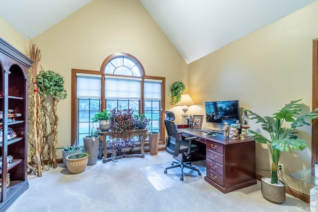 office with light carpet and high vaulted ceiling