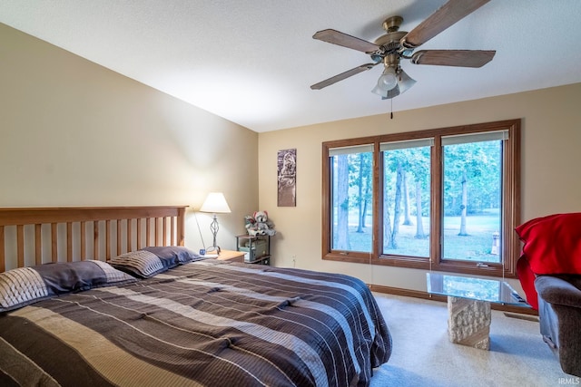 bedroom with ceiling fan and carpet flooring