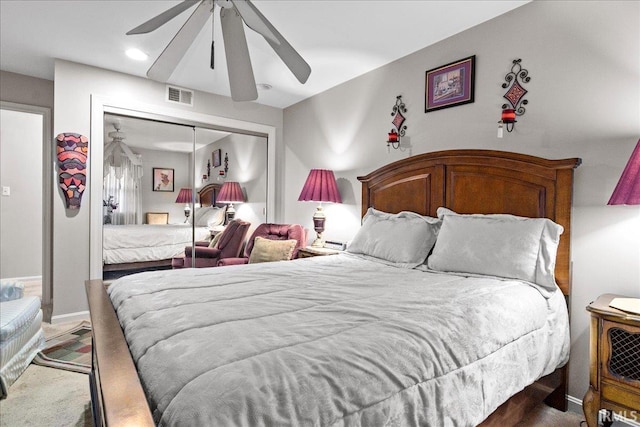 bedroom featuring ceiling fan and a closet