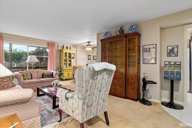 living room with ceiling fan and light colored carpet