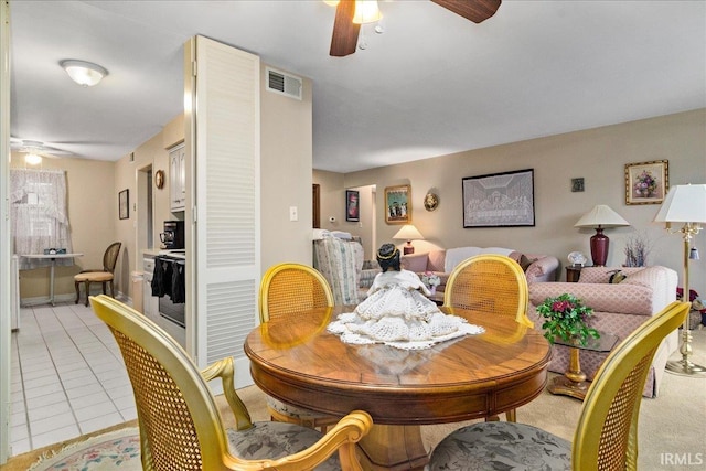 dining area with ceiling fan and light tile patterned floors