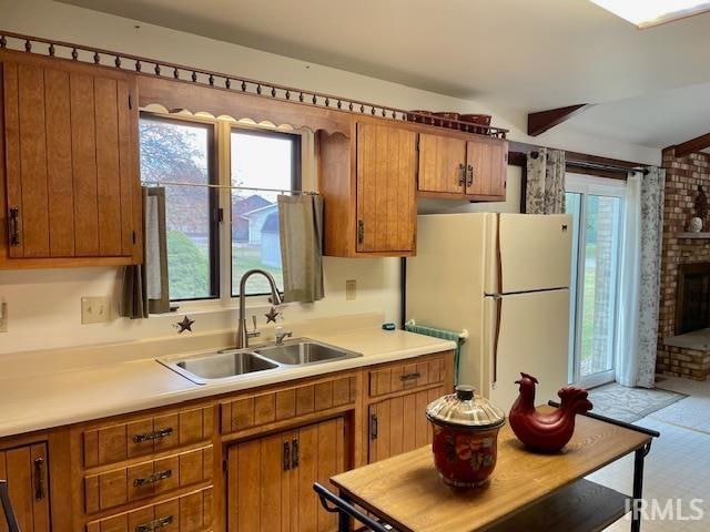 kitchen with sink and white fridge