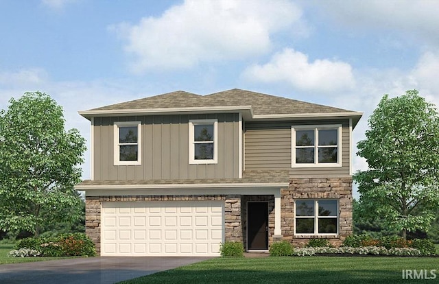 view of front of property with a garage and a front yard