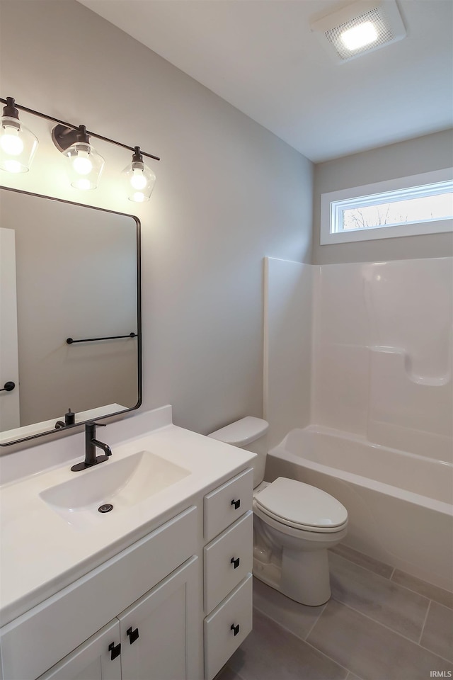 bathroom featuring visible vents, toilet, shower / bath combination, and vanity