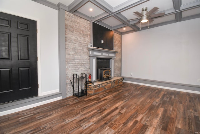 unfurnished living room featuring ceiling fan, hardwood / wood-style flooring, brick wall, and coffered ceiling