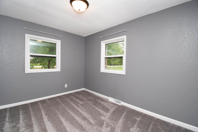 unfurnished room featuring carpet flooring