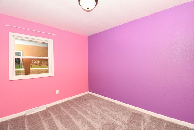 unfurnished room featuring carpet floors