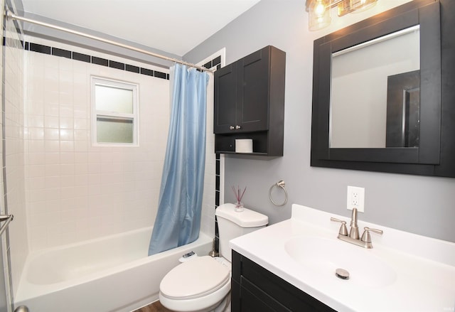 full bathroom with vanity, shower / bath combo with shower curtain, and toilet