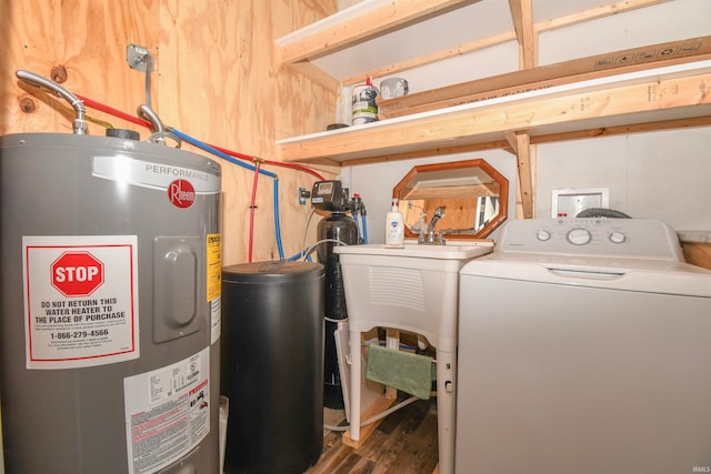 clothes washing area featuring wood walls, washer / dryer, electric water heater, and dark wood-type flooring