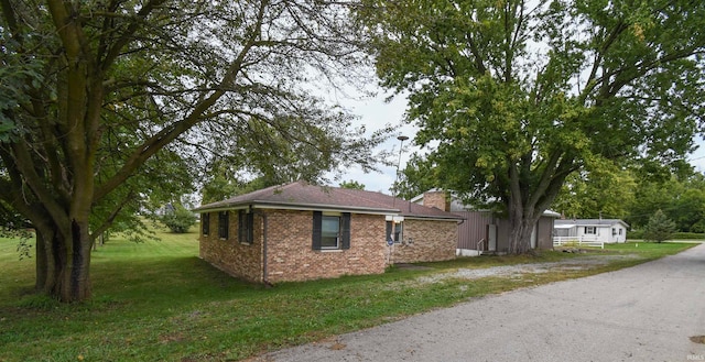 view of home's exterior featuring a yard