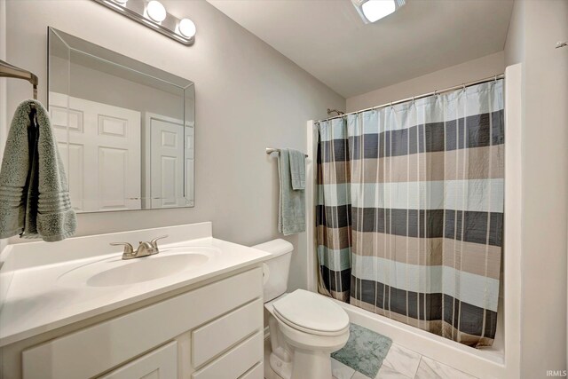 bathroom featuring vanity, toilet, and a shower with shower curtain