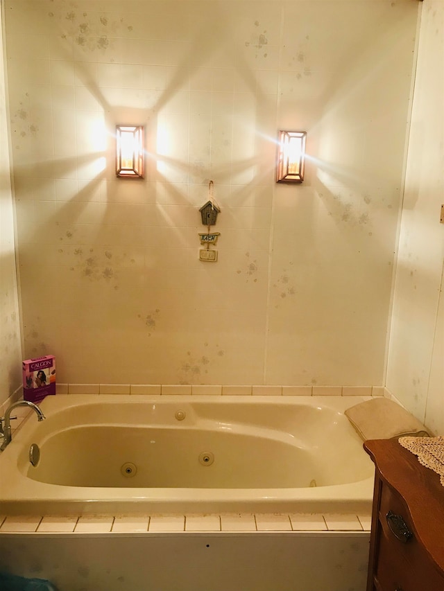 bathroom featuring tiled bath