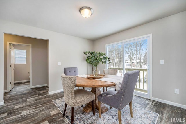 dining room with dark wood-type flooring