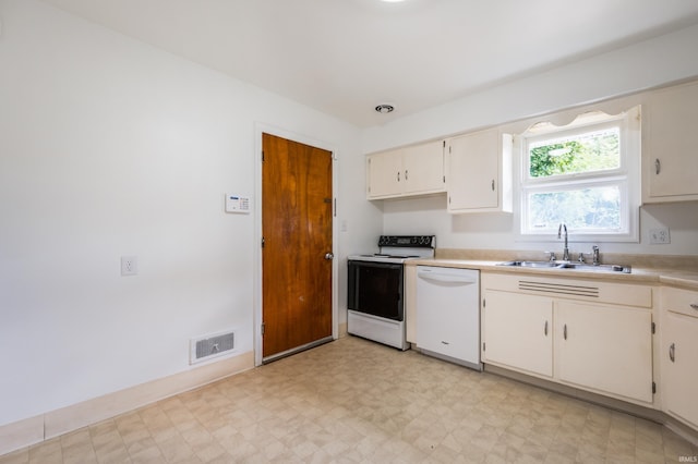 kitchen featuring white cabinets, sink, and white appliances