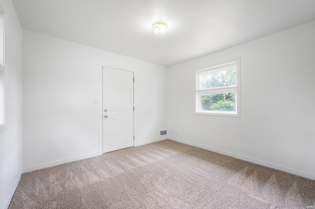 spare room featuring carpet floors