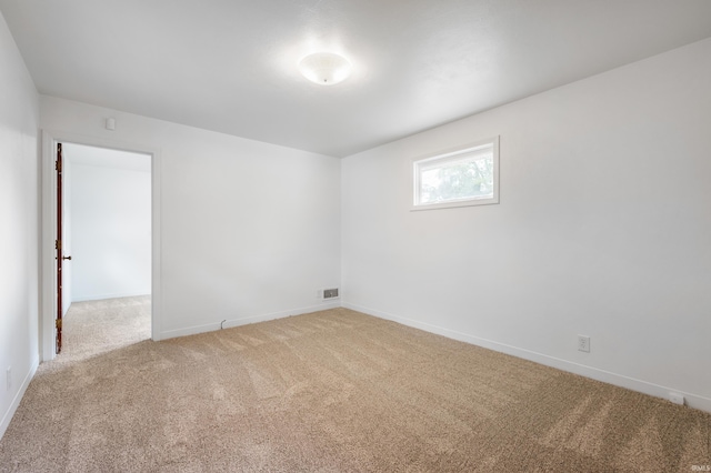 spare room featuring carpet floors