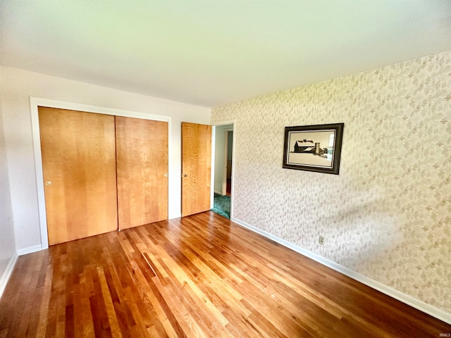 unfurnished bedroom with wood-type flooring