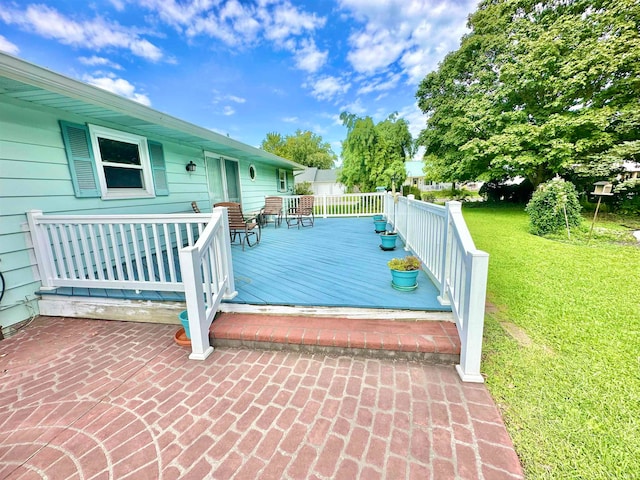 view of pool with a yard and a wooden deck