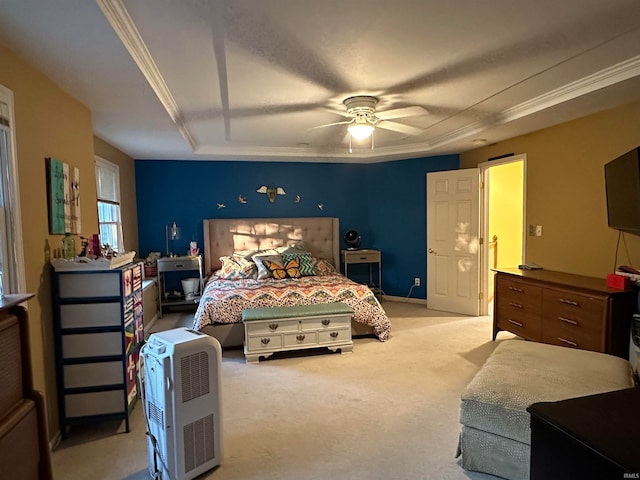 carpeted bedroom featuring ornamental molding and ceiling fan