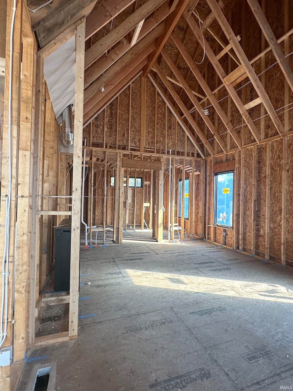 miscellaneous room featuring lofted ceiling