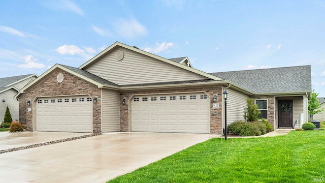 ranch-style home with a front lawn, central air condition unit, roof with shingles, concrete driveway, and an attached garage