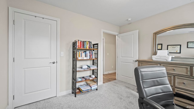 office area featuring light colored carpet