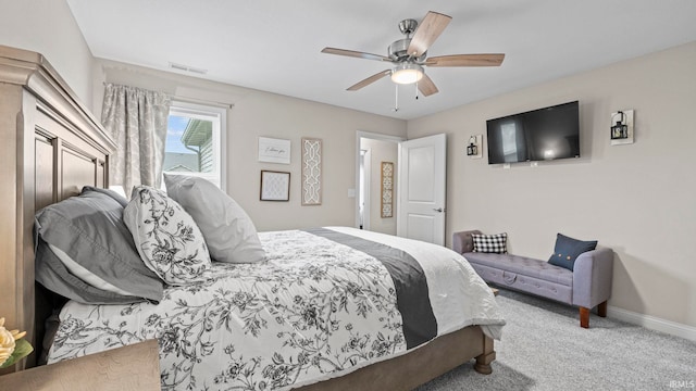 bedroom featuring baseboards, visible vents, ceiling fan, and carpet flooring