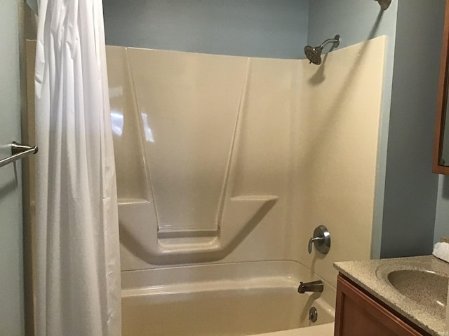 bathroom with vanity and shower / bath combo