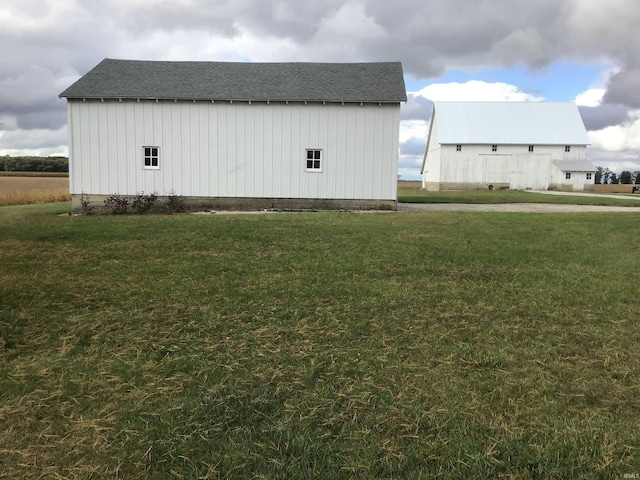 view of outdoor structure with a lawn