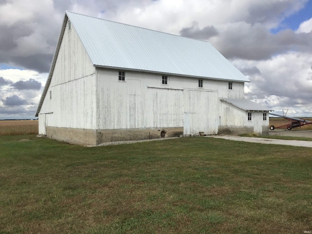 406 W 750 S, Star City, IN 46985 - view of home's exterior featuring a barn, a lawn, an outbuilding, and metal roof
