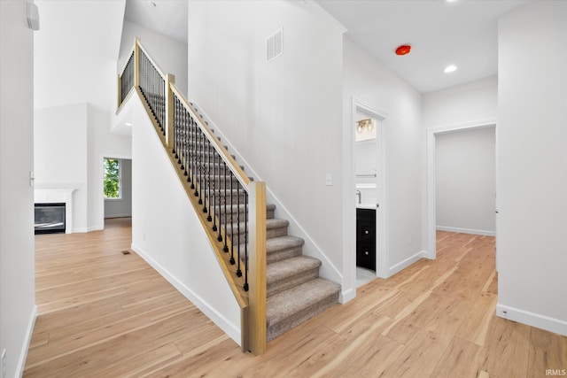 staircase featuring hardwood / wood-style floors