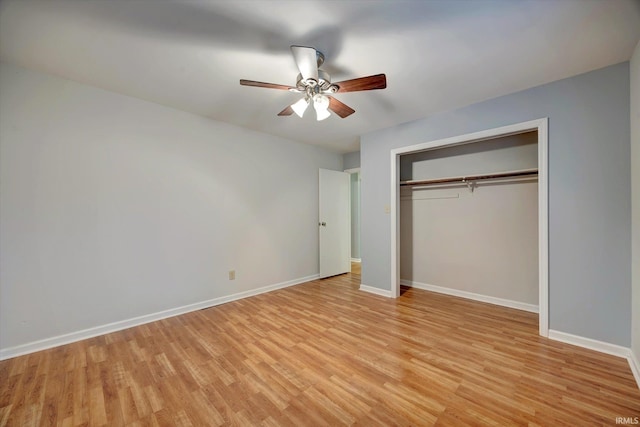 unfurnished bedroom with light hardwood / wood-style flooring, a closet, and ceiling fan