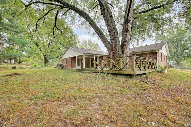 view of yard with a wooden deck