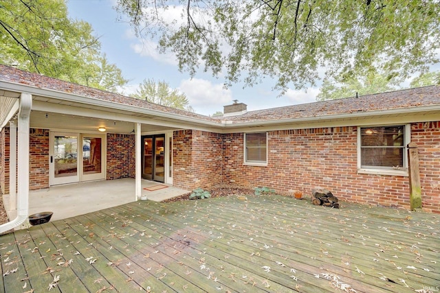 wooden terrace featuring a patio